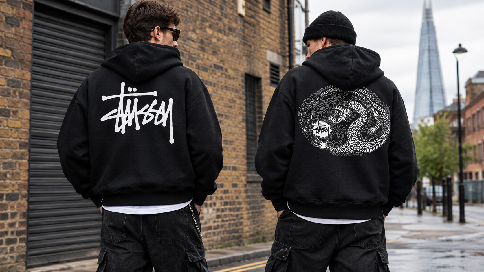 Two men in black Stussy hoodies.